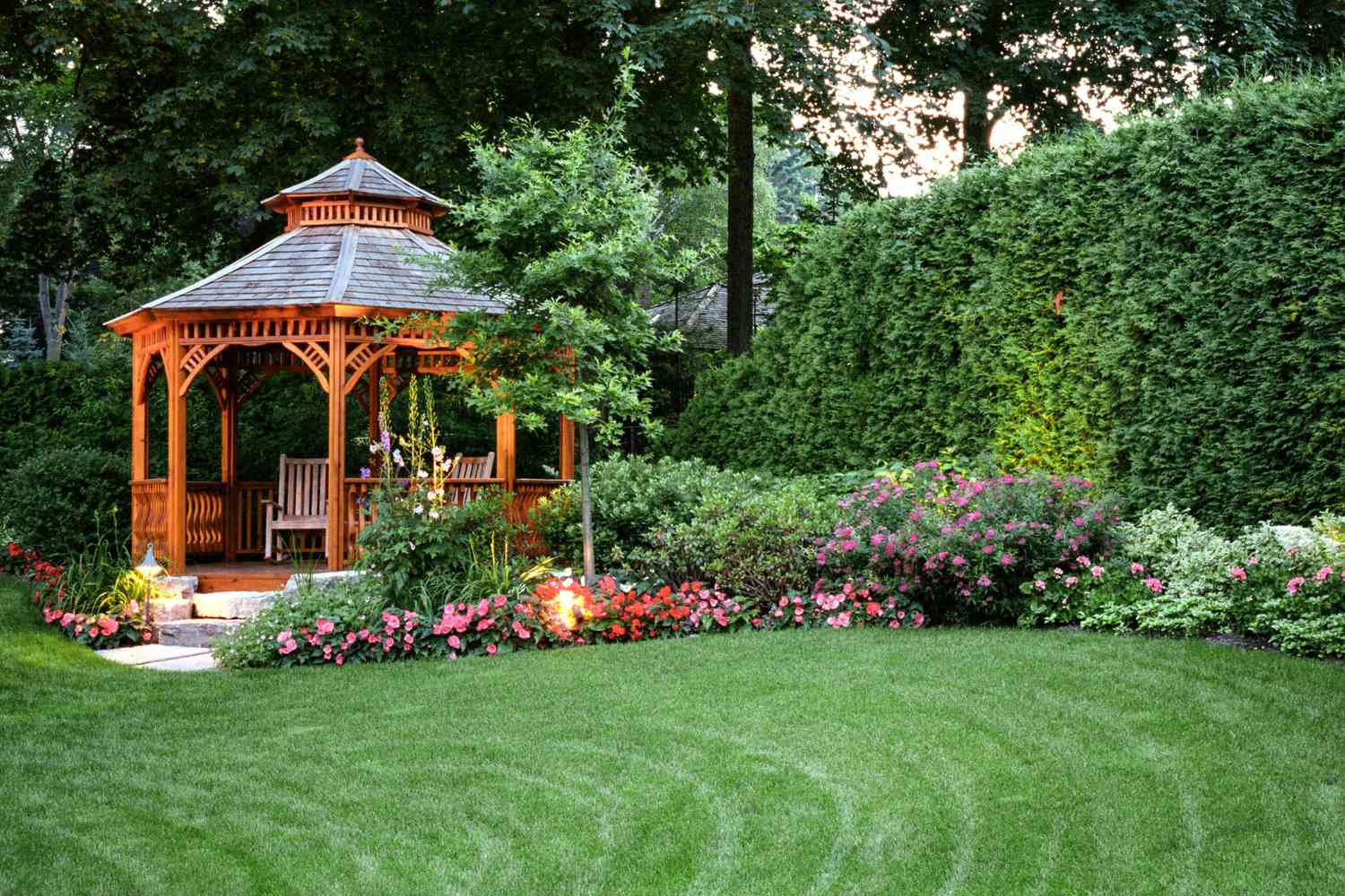 Beautifully landscaped backyard with a wooden gazebo